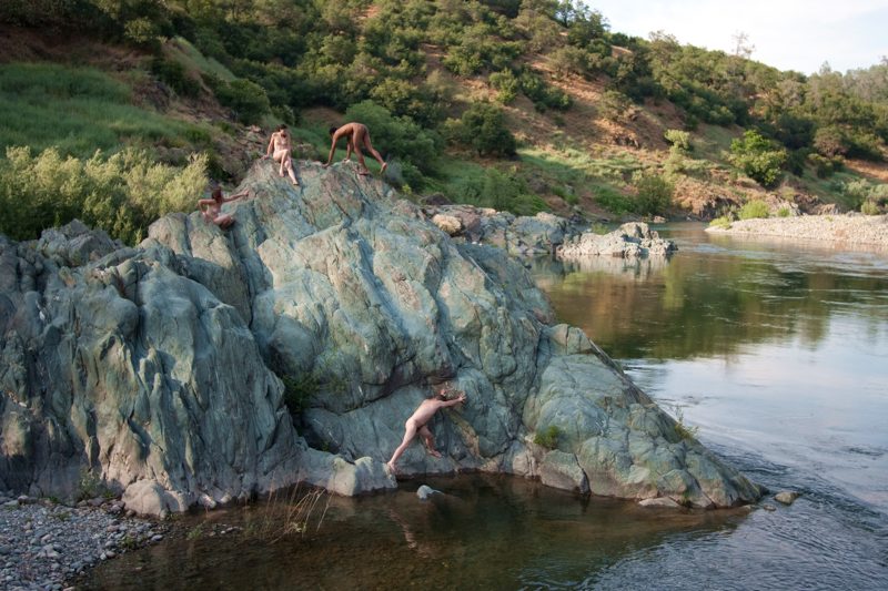 nude climbers on big rock